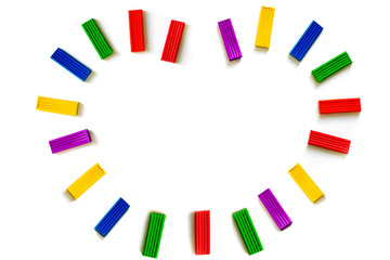 Multi-colored plasticine different shapes on a white background. How to organize classes with children at home. Motor development. Development of children's hands. Concept of education.