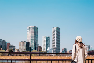 Fototapeta na wymiar Young woman walking in the city,japan,tokyo