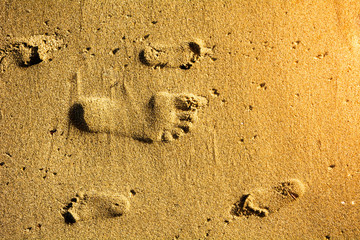 Footprints in sand adult and children