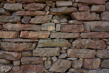 Fototapeta premium Old multicolored stone wall
