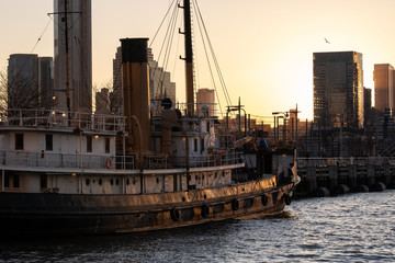 Sailing ship parking at pier 26 by Hudson river at sunset view from TriBeCa New York City