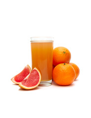 fruit juice in a glass, tangerine and grapefruit on a white background