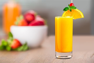 Two glasses of lemonade on blurred background