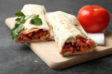 Doner kebab, shawarma in pita and tomato with parsley