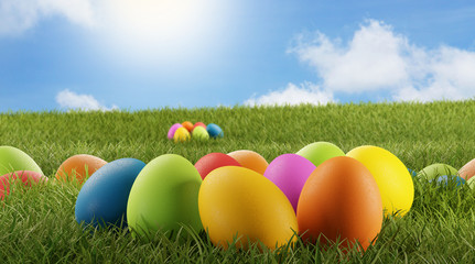 Fototapeta na wymiar Colorful Easter eggs for Easter in the grass of a meadow 3d-illustration
