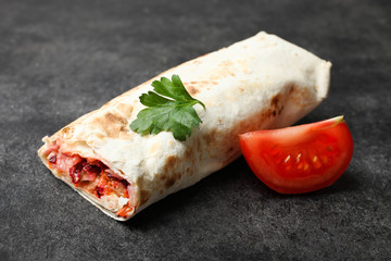 shawarma in pita bread with tomato and parsley