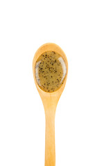 Scrubbing honey and coffee mixture on body in hot sauna helps open the pores and renew, rejuvenate the skin on body. Sauna treatment. Wooden spoon with sauna honey isolated on white background.