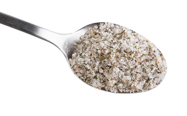 top view steel spoon with seasoned salt close up