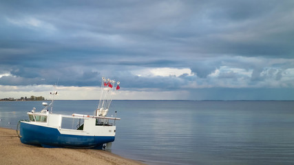 Fototapeta na wymiar Fishing boat on Baltic Sea coast.