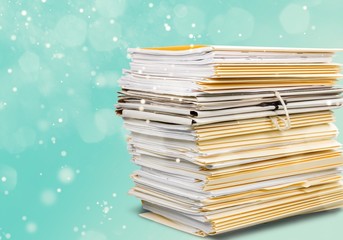 File folders with documents isolated on white background
