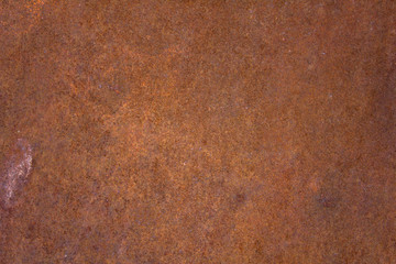 brown rusty metal sheet with blue dots. rough surface texture