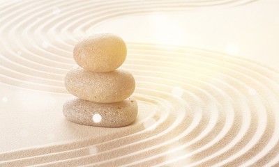 Zen stones in the sand. Beige background