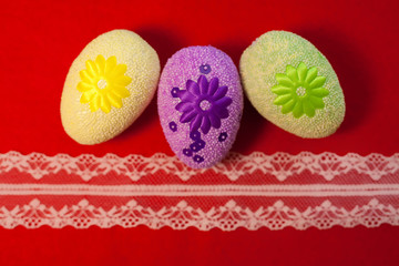 Decorative eggs on red background . Concepts Easter, eggs, hand made,