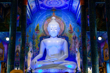 Blueish Buddha Statue inside the Blue Temple (Rong Sua Ten temple) in Chiang Rai, Thailand.