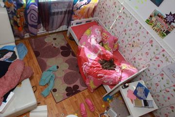 mess in the room. Scattered toys. It's hard being a housewife.