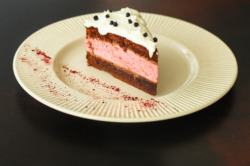 cake mousse berry, chocolate biscuit - dessert is sweet and tasty. piece of cake. food background. top