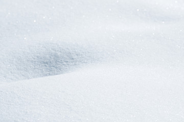 Fototapeta na wymiar Fresh snow background texture. Winter background with snowflakes and snow mounds. Snow lumps.