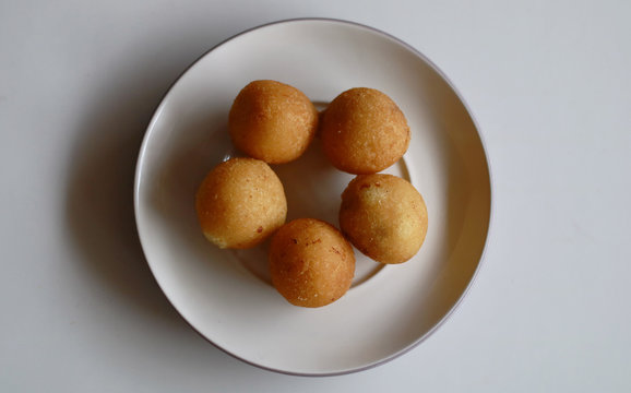 Indonesian Traditional Fritters, Misro.  Made from deep fried cassava and filled with palm sugar.