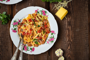 homemade pasta with meatballs in tomato sauce