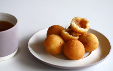 Indonesian Traditional Fritters, Misro.  Made from deep fried cassava and filled with palm sugar.