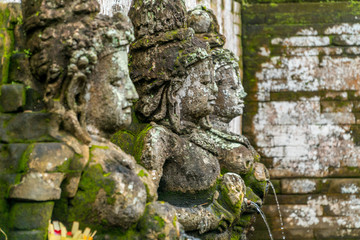 Bathing Temple traditional figures in Goa Gajah Temple (Elephant Cave) on Bali