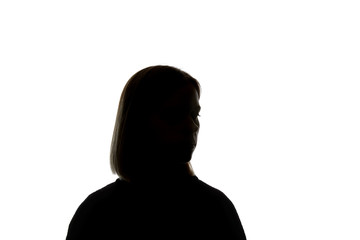 Silhouette of woman looking away isolated on white