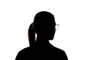 Silhouette of woman in glasses looking away isolated on white