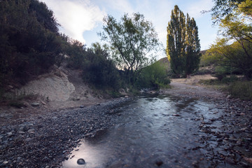 Long exposure shot of a litle creek descending from the mountain in Patagonia