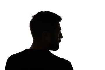Silhouette of man looking away isolated on white