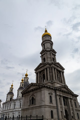 Fototapeta na wymiar Kharkiv, Ukraine: The Assumption, or Dormition Cathedral, with a 90 m bell tower is the tallest building in Kharkiv. It was the main church of Kharkiv until construction of the Annunciation Cathedral