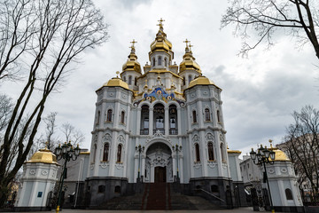 Fototapeta na wymiar Kharkiv, Ukraine: Mironositskaya Church, known also as Myrrh-Bearers temple, is located in Peremohy Garden Square in front of the State Academic Opera and Ballet Theatre