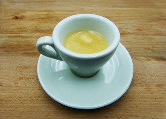 Espresso, traditional italian coffee in white ceramic cup with saucer 