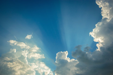 Fototapeta na wymiar blue sky with clouds and sunbeam