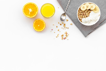Bright breakfast with granola and orange juice on white background top view mockup