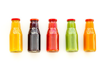 vegetable and fruit juice in bottles for diet drink on white background top view mock up