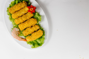 Traditional oriental cuisine of  Vietnam. Tempura shrimp, sole fish and seafood breaded with salad
