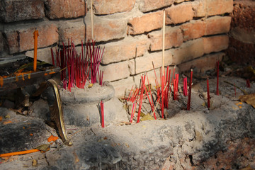 Incense sticks in a buddhist temple in Lamphun (Thailand)