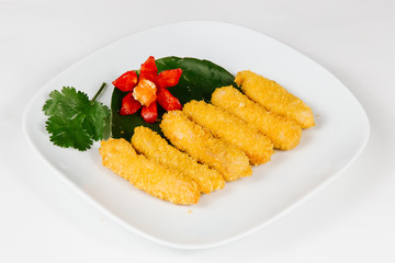 Traditional oriental cuisine of  Vietnam. Tempura chicken in breading with chilly on on pineapple leaf