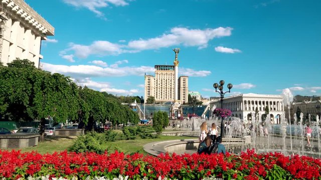 Maidan Nezalezhnosti in Kyiv, Ukraine. Blooming flower beds and fountains in the center of Kiev on Independence sguare on a sunny day