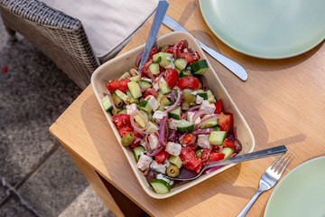 Looking down on a salad on an outdoor table, ready for Alfresco dining