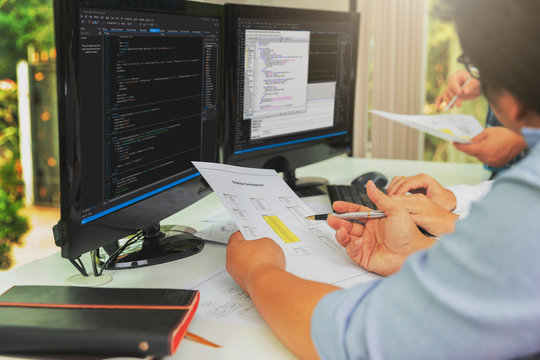 Programmers team working in a software developing. Developing programming and coding technologies. Website design. Cyber space concept.