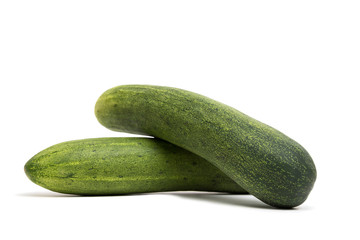 Two cucumbers isolated on a white background.