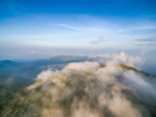 Wind power generator before sunrise sunset ，Wind power generation in the sea of clouds