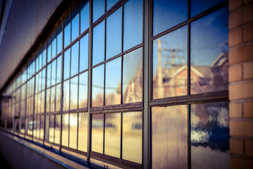 reflection in factory warehouse windows 