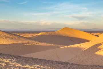 Fototapeta na wymiar Looking out across the Imperial Sand Dunes in California, on a sunny early morning