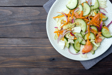 Vegetarian salad of raw fresh vegetables in a plate. Concept healthy eating Copy space
