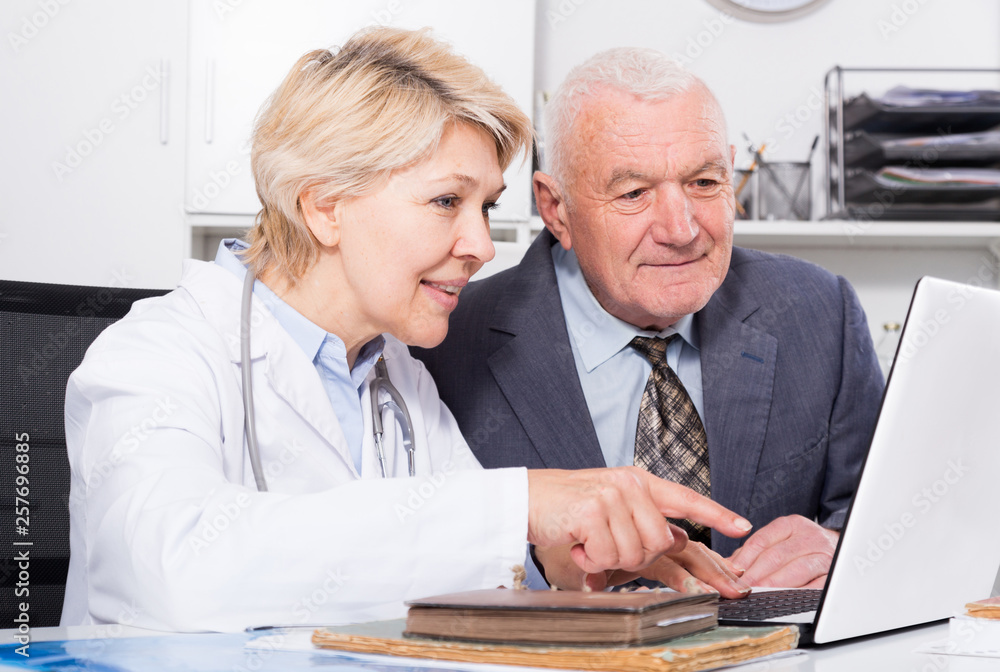 Wall mural female doctor with male client