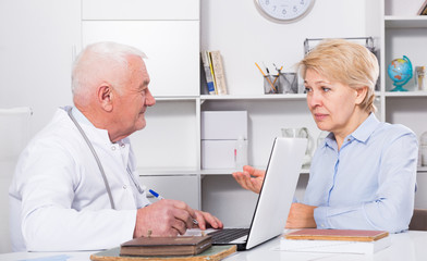 Male doctor with female client