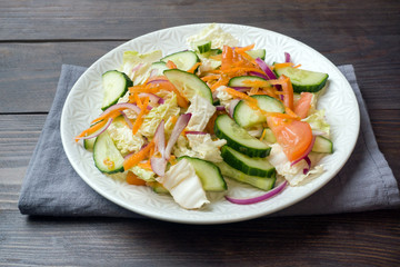 Vegetarian salad of raw fresh vegetables in a plate. Concept healthy eating Copy space