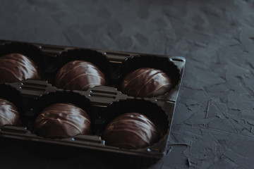 Chocolate cakes on a dark background